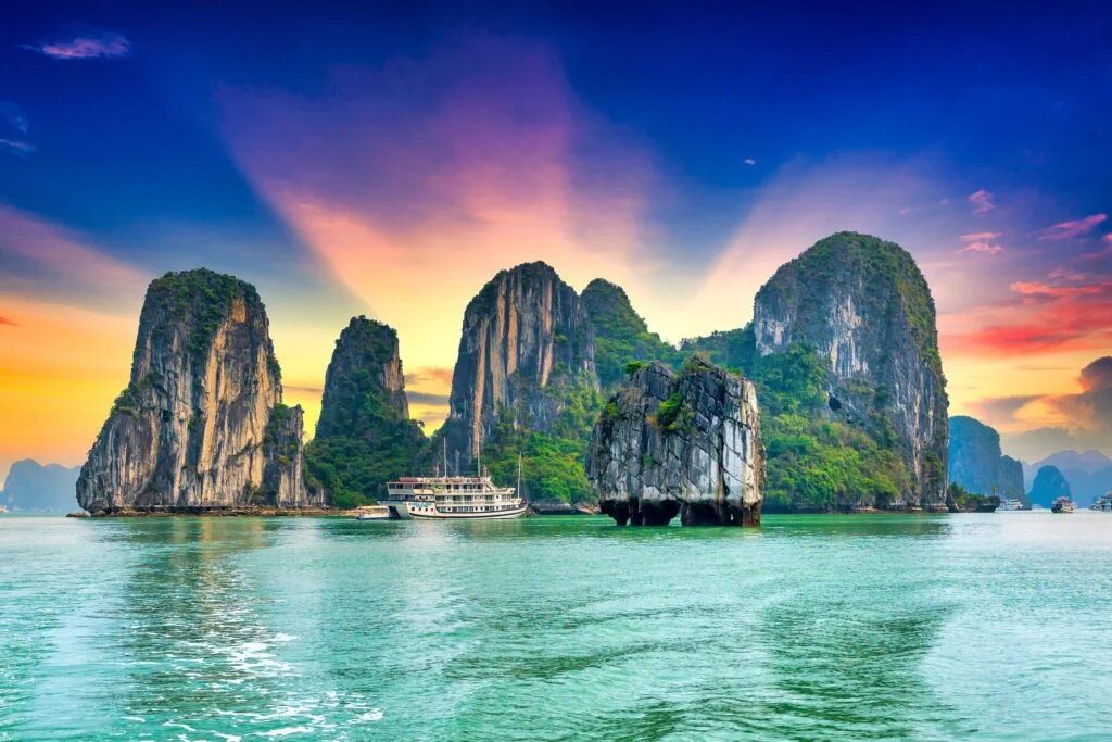 Ha Long Bay limestone islands at sunset in Vietnam