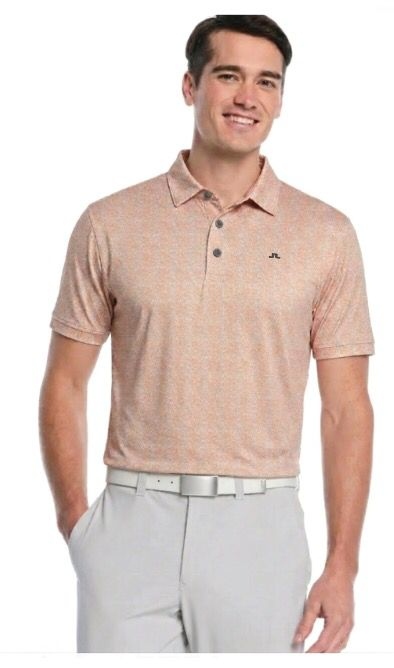 Custom orange golf polo on model — performance golf apparel Australia