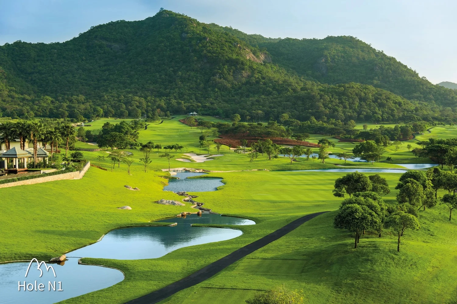 Phuket golf course with mountain lakes and lush fairways — Thailand golf tours